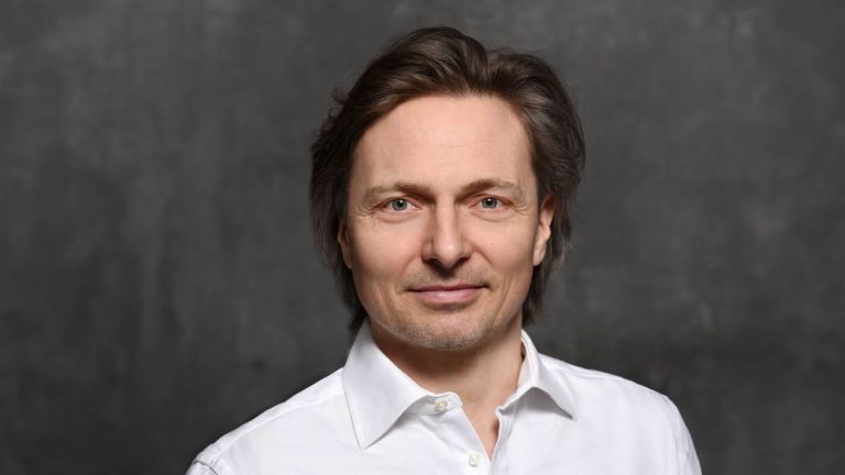 Cybersecurity expert Janusch Skubatz, Chief Information Security Officer of the EOS Group, with brown hair and white shirt